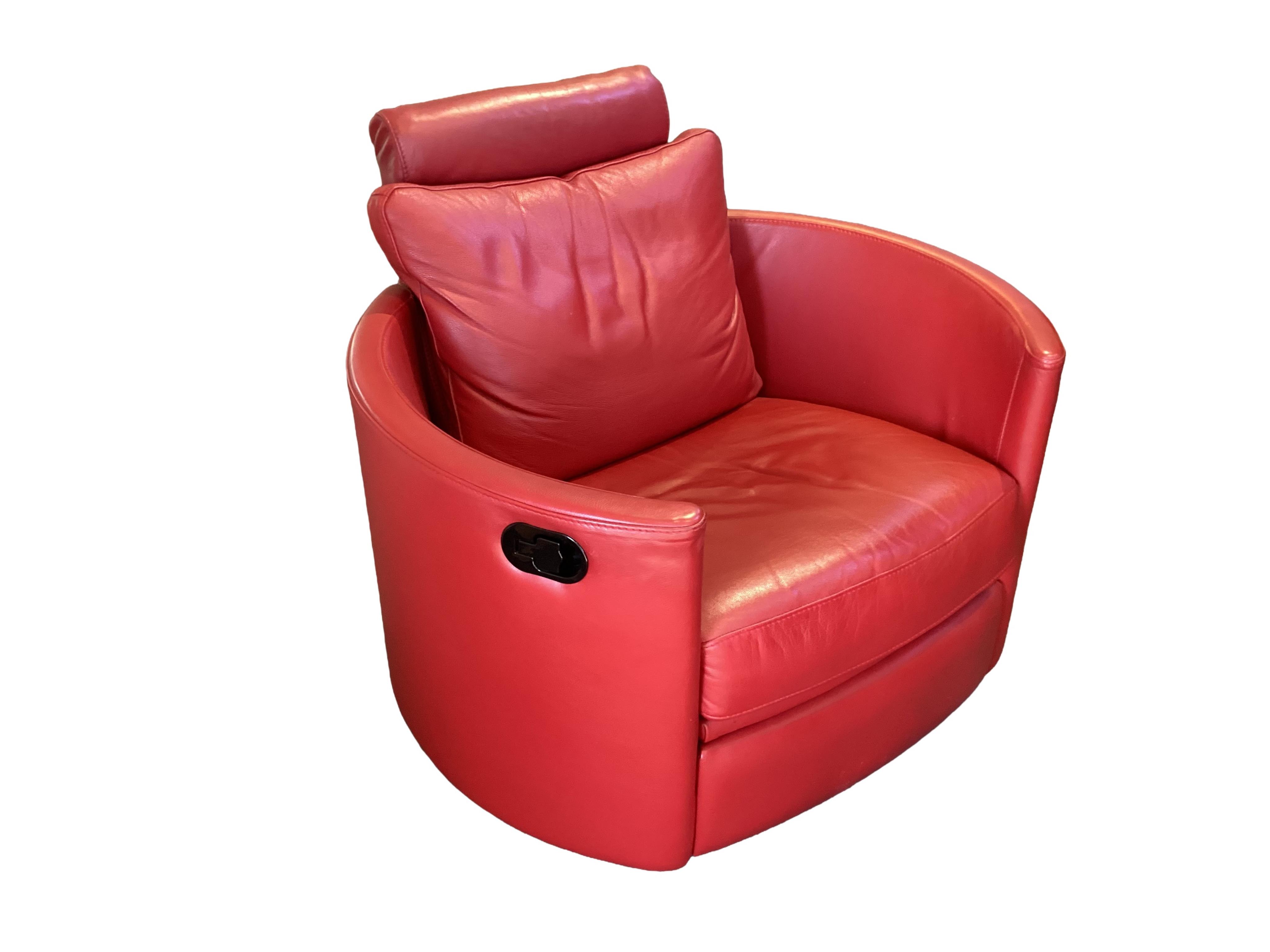 A pair of Contemporary red leather reclining rocking armchairs, Darlings of Chelsea, width 106cm, depth 90cm, height 94cm